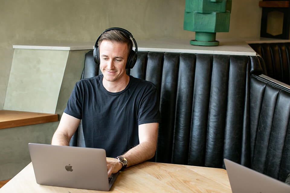 AI Blogger Working on Planning From Coffee Shop Ryan Robinson