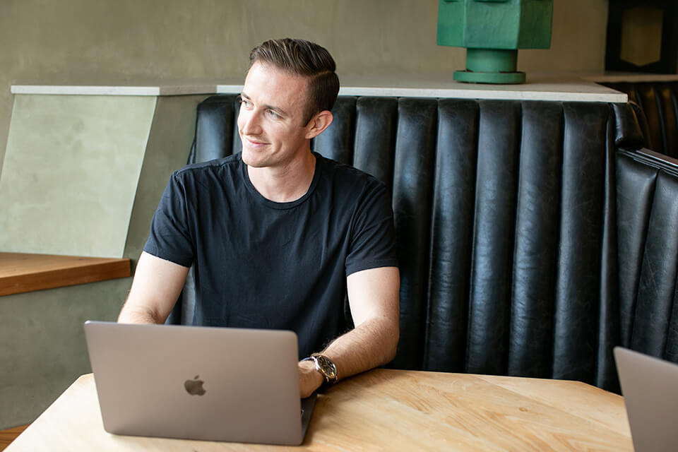 Ryan Robinson Blogging (Head Shot) Photo of Blogger Working at Coffee Shop