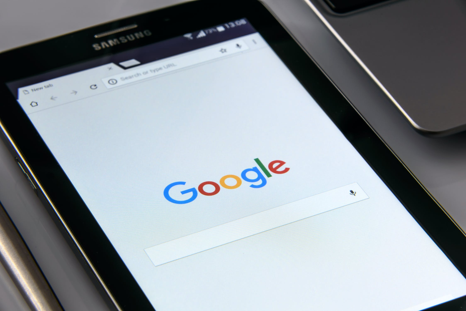 SEO (Search Engine Optimization) Best Practices to Nail Your Blog Marketing Efforts - Image of Phone with Google Open