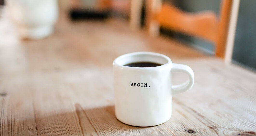 Guest Blogging (as a Blog Marketing Strategy) Stock Photo of Working at a Table with Coffee