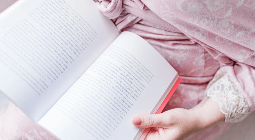 Stock photo of a woman reading an introduction to a book