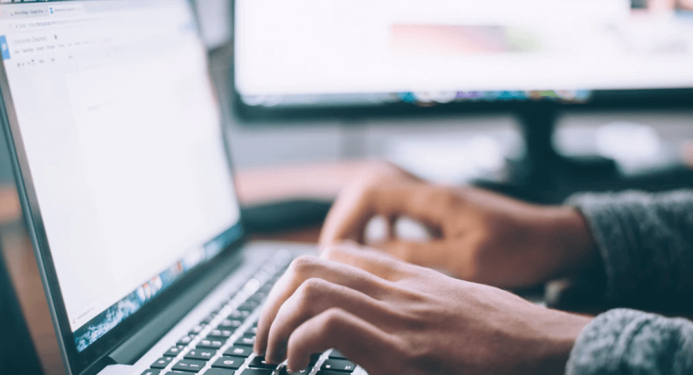 Stock Image of Typing on a Computer into Google