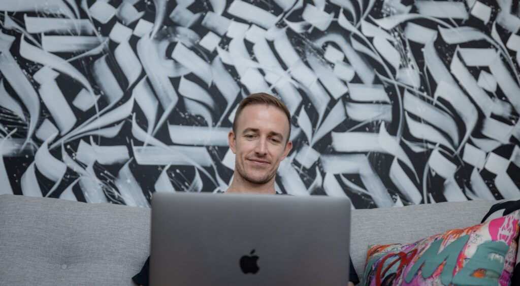 Ryan Robinson Blogger Stock Photo Typing on Laptop Computer